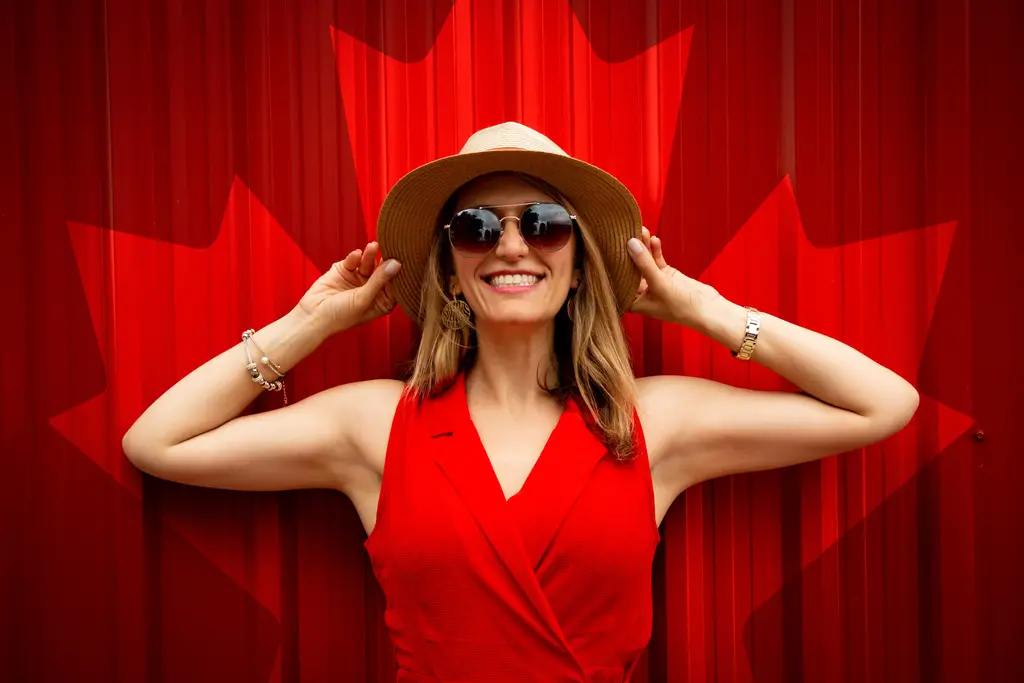 halter neckline woman in red dress in shape of Canadian flag 
